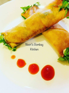 A picture of Chicken and cheese spring roll.
