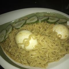 A picture of Indomie with boiled egg.
