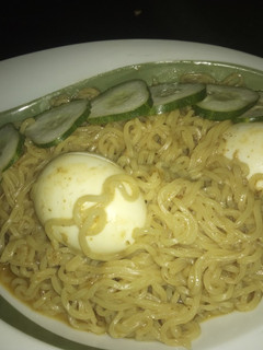 A picture of Indomie with boiled egg.