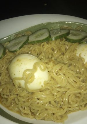 A picture of Indomie with boiled egg.