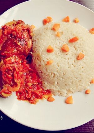 A picture of Coconut Rice and sauce.
