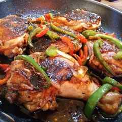 A picture of Pan-roasted chicken with peppers.