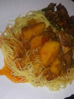A picture of Spaghetti with wet fried beef.