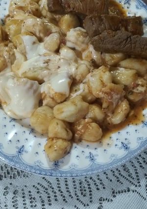 Una foto de Ñoquis de papa con queso gratinado 🤤