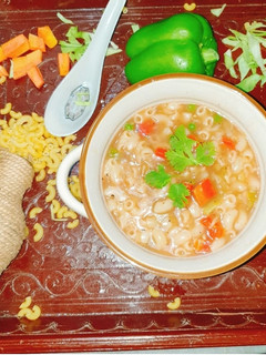A picture of Veg macaroni soup.