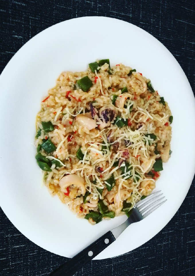 Una foto de Risotto con calamar y judías planas