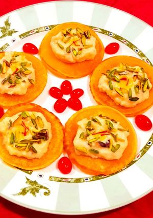 A picture of Kesar Pista Rabdi With Custard Pancake.