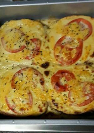 A picture of Cheese and tomato baked toast.