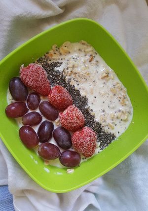 A picture of Overnight Oats Topped With Strawberries and Grapes.