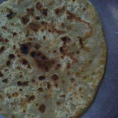 A picture of Bajra makke gehu mix stuff aloo gobhi ke paratha.