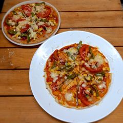 A picture of Homemade pizza with babycorn topping.