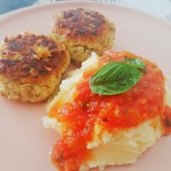 A picture of Fish Cakes with Mash and tomato relish.