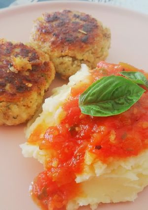 A picture of Fish Cakes with Mash and tomato relish.