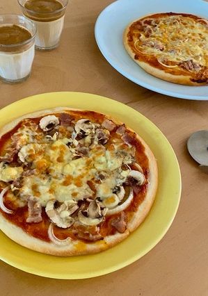 A picture of Pizza with lots of mushrooms!.