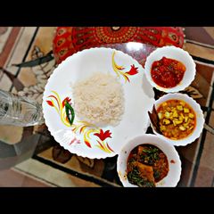 A picture of Rice,Narkel Cholar Dal,Dhokar Dalna and Mishty Tomato Chutney.