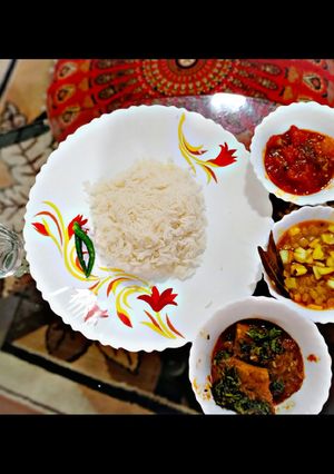 A picture of Rice,Narkel Cholar Dal,Dhokar Dalna and Mishty Tomato Chutney.