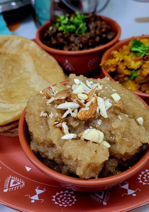 A picture of Ashtami Bhog Thali (Halwa, Puri, Kala Chana).