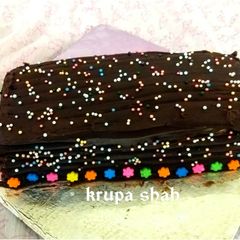 A picture of Leftover roti and milk chocolate's chocolate log cake.