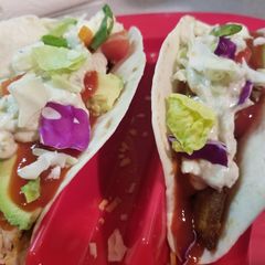 A picture of Fish tacos with awesome sauce.