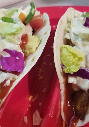 A picture of Fish tacos with awesome sauce.