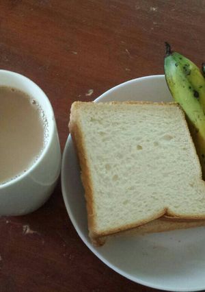 A picture of Breakfast Triple Combo(Tea, banana & Bread).