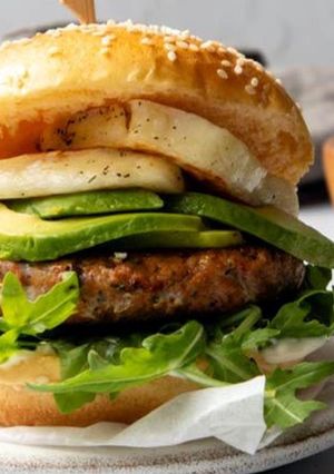 A picture of Chicken, Red Pepper & Feta Burger with Avo & Halloumi.