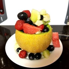 A picture of My Fruit Mix in a Galia Melon Bowl 😎.