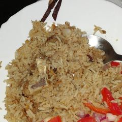 A picture of Pilau and salad.