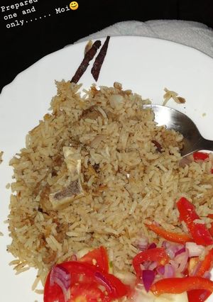 A picture of Pilau and salad.