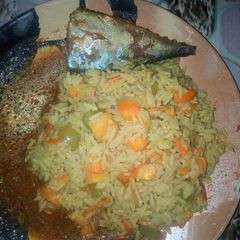 A picture of Fried rice with fish soup.