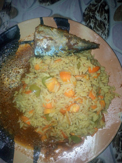 A picture of Fried rice with fish soup.