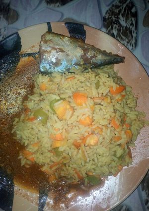 A picture of Fried rice with fish soup.