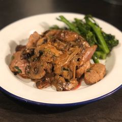 A picture of Pork tenderloin with mushroom, shallot and tarragon sauce.