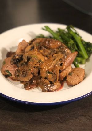 A picture of Pork tenderloin with mushroom, shallot and tarragon sauce.