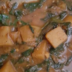 A picture of Vegan potato and spinach curry.