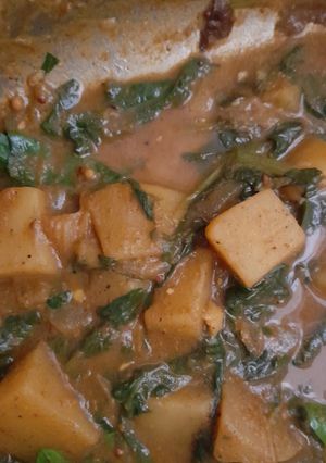 A picture of Vegan potato and spinach curry.