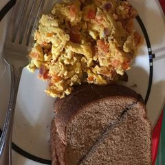 A picture of Fried Scramble and wheat bread.