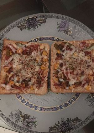 A picture of Cheese corn open sandwitch.