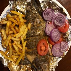A picture of Grilled fish and fries.