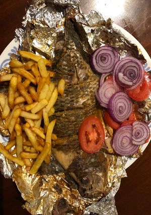 A picture of Grilled fish and fries.