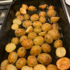 A picture of Roast potatoes in ghee (clarified butter).