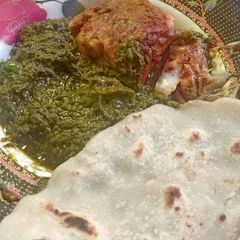 A picture of Fish with sarso ka saag.