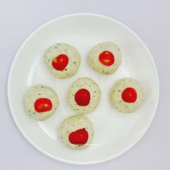 A picture of Instant Coconut cranberry stuffed Ladoo.