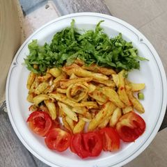 Favorite chips garnished with salad nd tomato A picture of Favorite chips garnished with salad nd tomato.