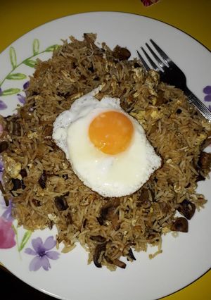 A picture of Mushroom rice with eggs two ways.