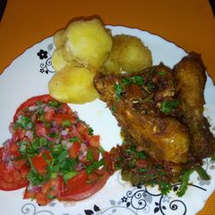 A picture of Wet fried chicken with crunchy roast potatoes.