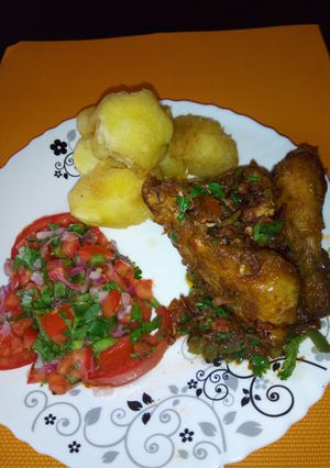 A picture of Wet fried chicken with crunchy roast potatoes.