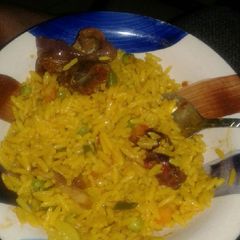 A picture of Fried rice and pepper gizzard.