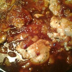 A picture of Peppery chicken with a plum glaze.