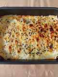 Lasaña de acelgas con lonchas de pavo y queso lista para gratinar y comer